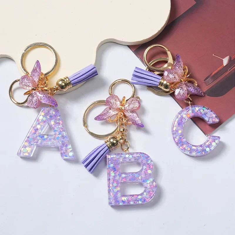 Cute Butterfly Tassel Letter Keychain Purple Stars Sequins Filled Resin A to Z Letter Keyring for Women Purse Charm Festive Gift