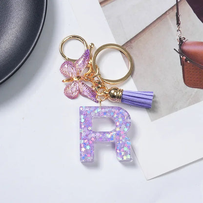 Cute Butterfly Tassel Letter Keychain Purple Stars Sequins Filled Resin A to Z Letter Keyring for Women Purse Charm Festive Gift